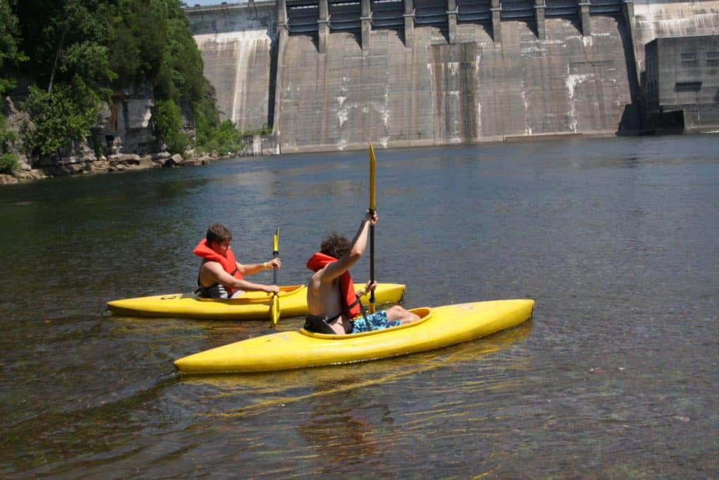 2 paddlers in a kayak rental on the river
