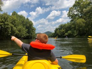 paddler enjoying a kayak rental on the river