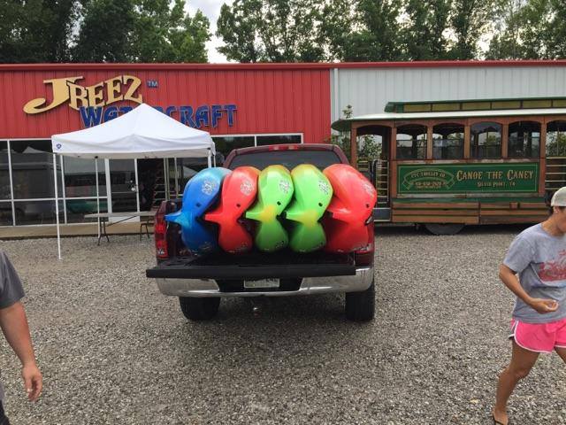 kayaks in a truck for self service rental pickup